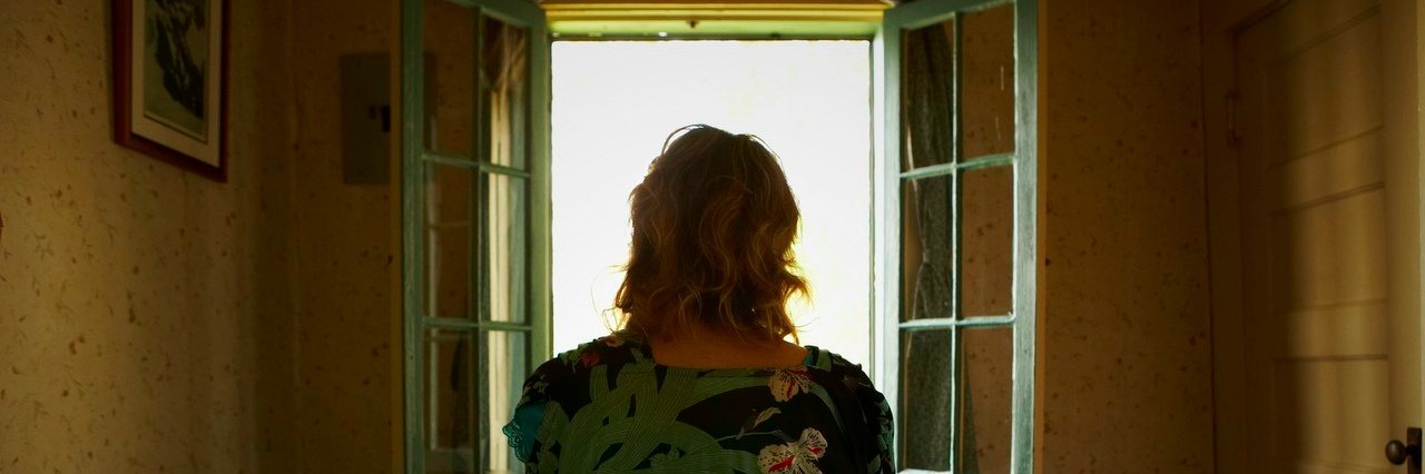 This Is How My Insomnia Affects Me Woman sitting on bed looking out window