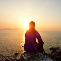 woman hiker watching the sunrise