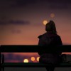 woman sitting on a bench at night