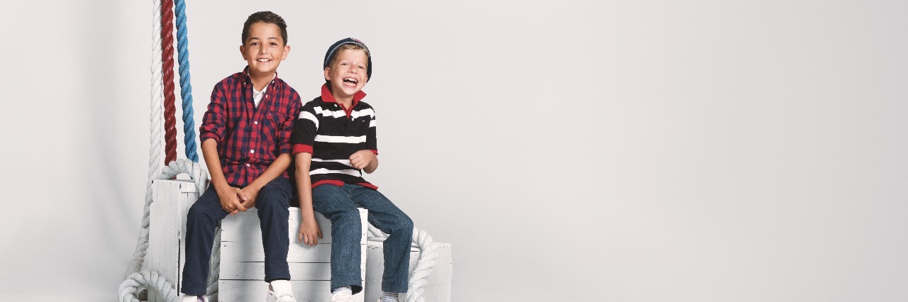 Tommy Hilfiger Releases Fall Collection for Kids With Disabilities Two boys modeling Tommy Hilfiger clothing