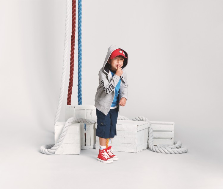 Little boy modeling Tommy Hilfiger clothes