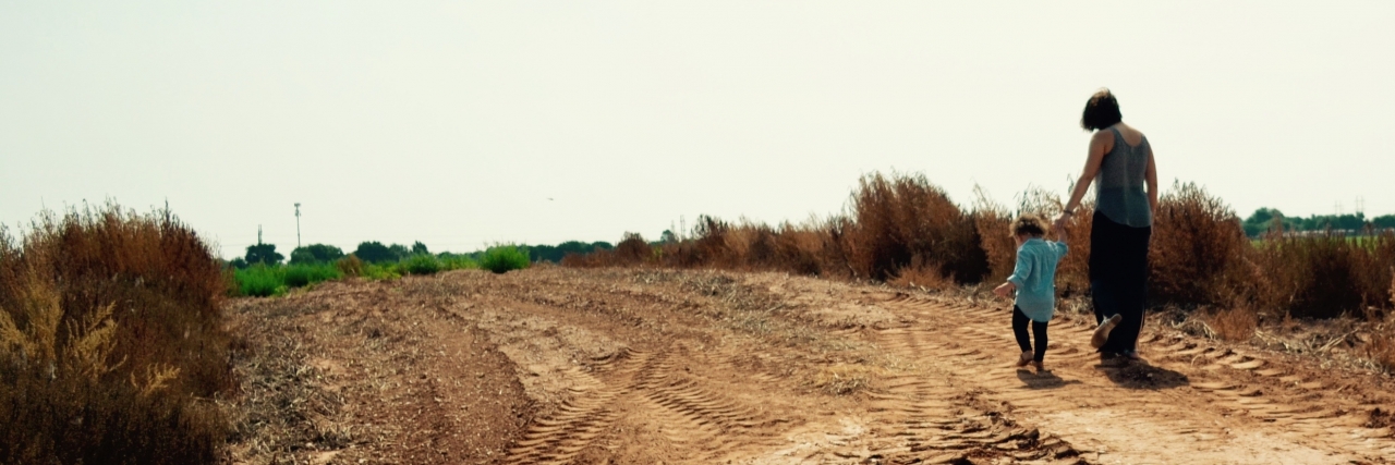 What a Mother With Cancer Wants Others to Tell Her Daughter mom and daughter walking on trail