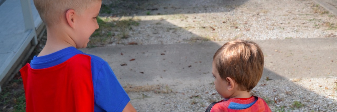 Boy With Scoliosis Helps Friend in Hospital With Superhero Cape two boys in capes