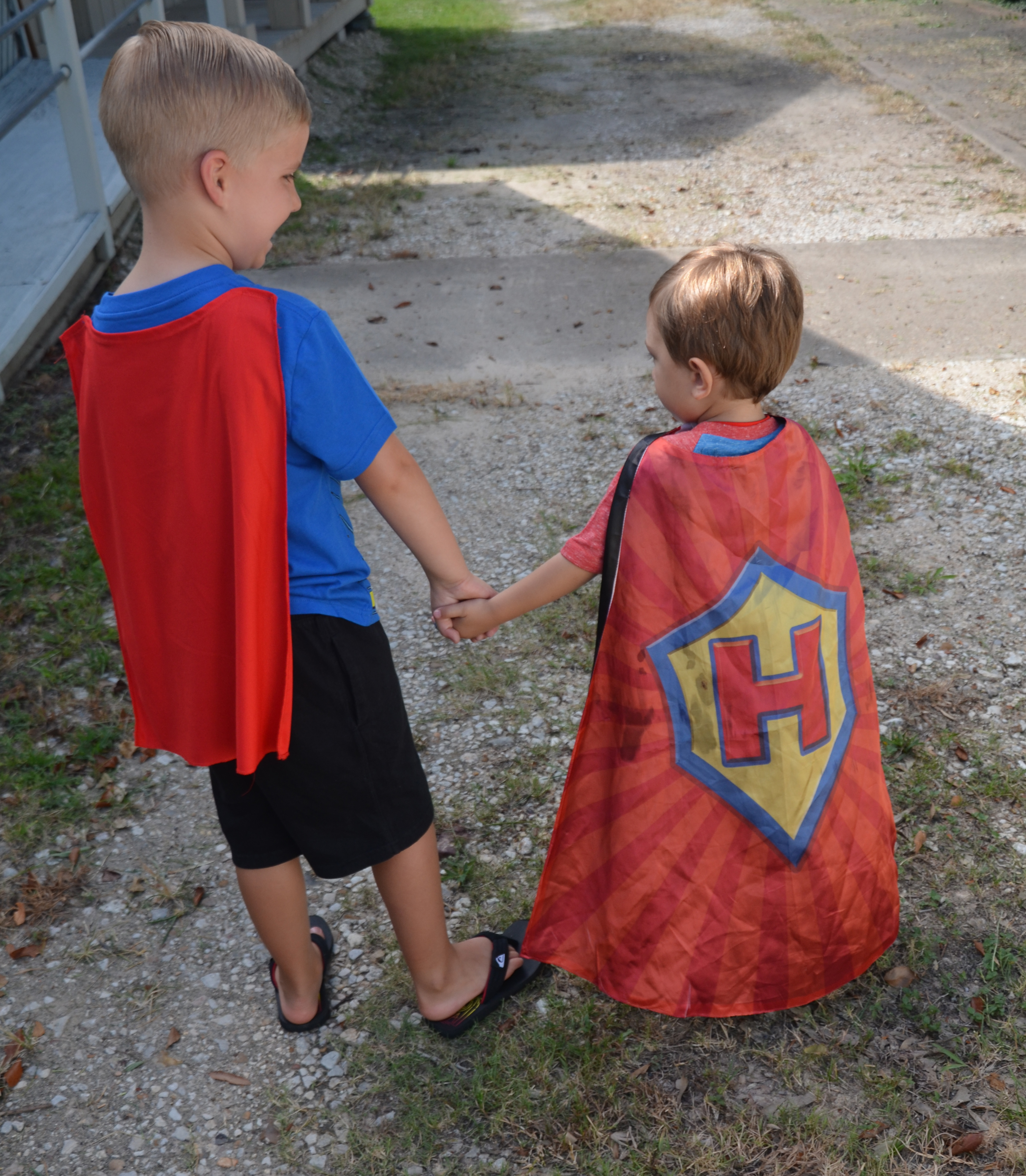 two boys in capes