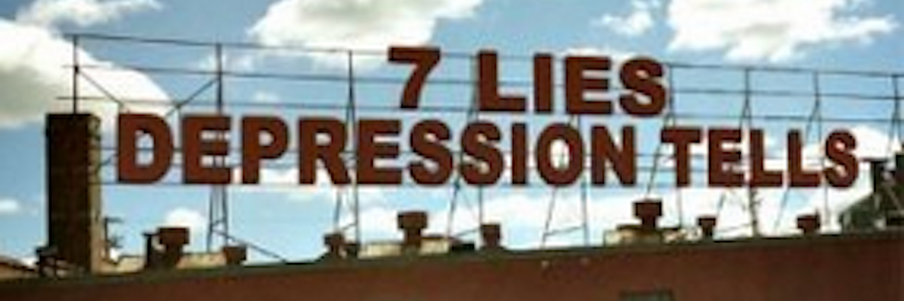 The Lies Depression Tells You The words "7 Lies Depression Tells" on a building