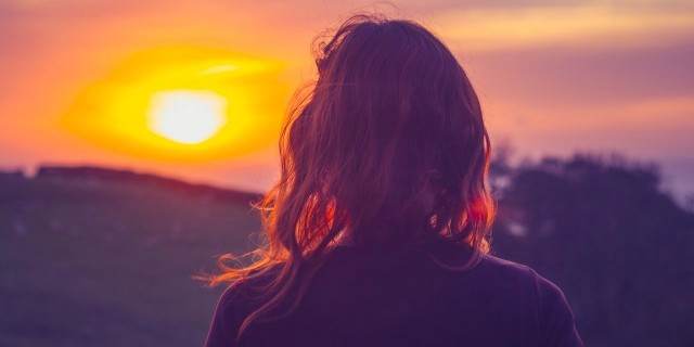 When I Can’t Move My Body Because of Cataplexy Young woman admiring the sunset over fields