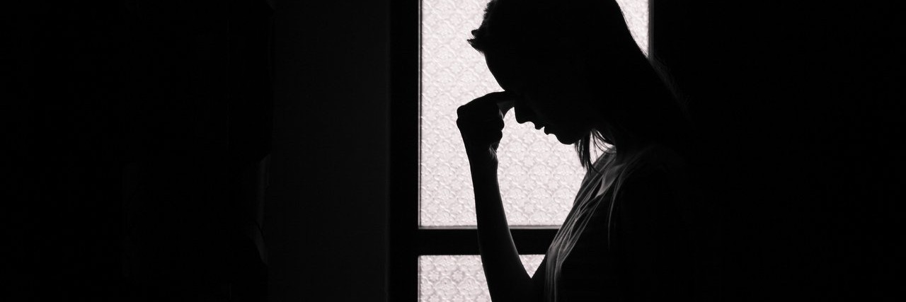 Student Who Is Afraid of Medication Thinks of Others Who Took It young woman in a dark room