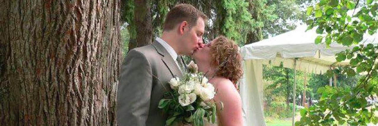 How to Support a Loved One With a Chronic Illness Emily and Scott Filmore on their wedding day