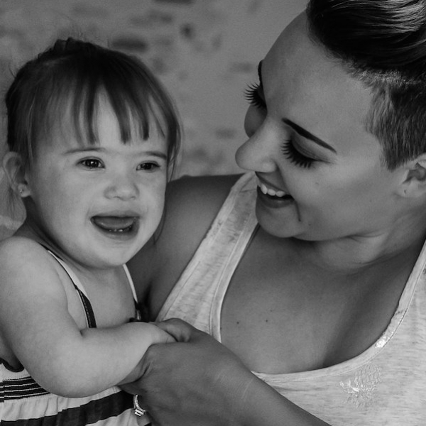 Black and white photo of mom holding her daughter