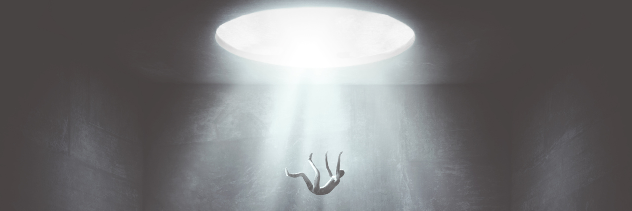 When Rock Bottom With Bipolar Disorder Comes With Suicidal Urges abstract image of a person falling down into a black void