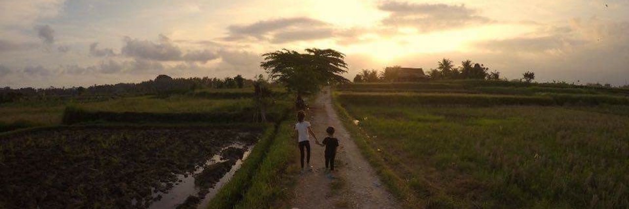 Living in Bali With Anxiety and Panic Disorder Two children, holding hands and walking down a trail
