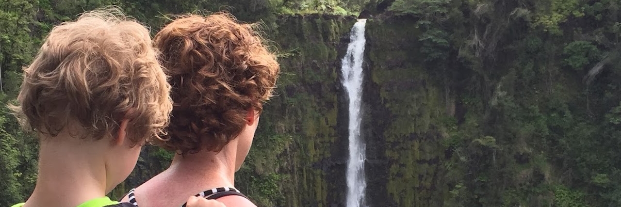 Letter to Mom Who Wrote 'I Still Carry My 5-Year-Old Son' mom with son on her back looking at a waterfall