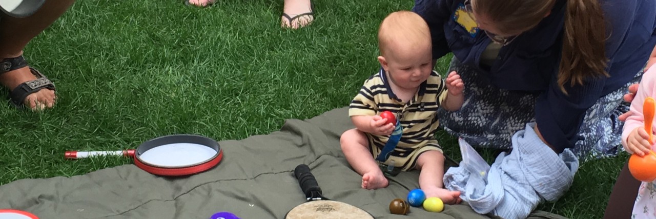 NICU Reunion: Reasons I'm Glad We Went baby doing music therapy at the NICU