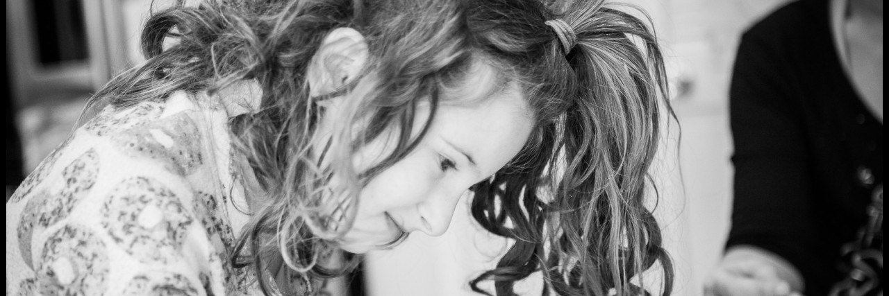 Olga Starr Photographs Special Needs Kids in 'Small Steps Giant Leaps' little girl coloring