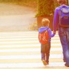 parent walking son to school