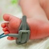 foot of newborn baby in an incubator chamber