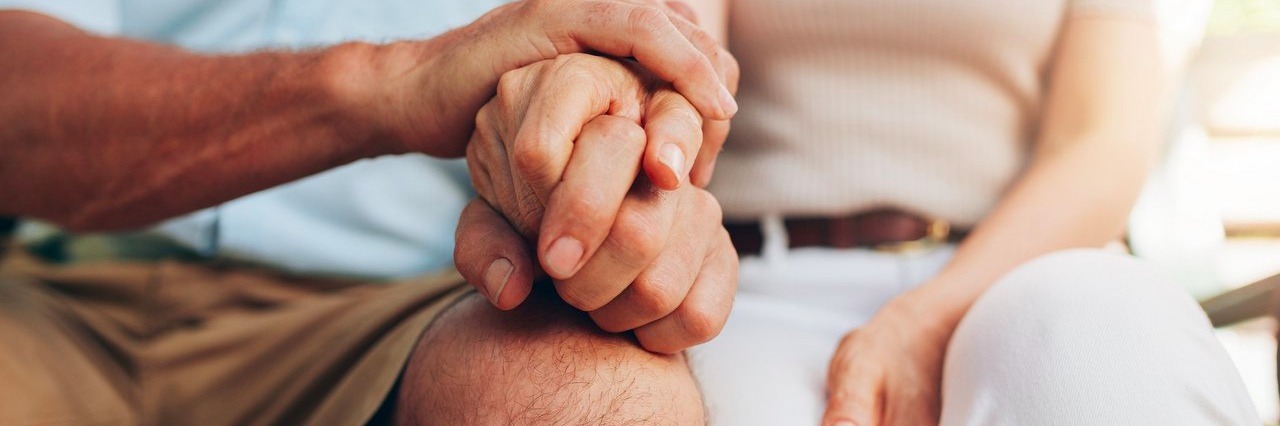 The Day My Husband Was Diagnosed With Type 1 Diabetes couple sitting together and holding hands