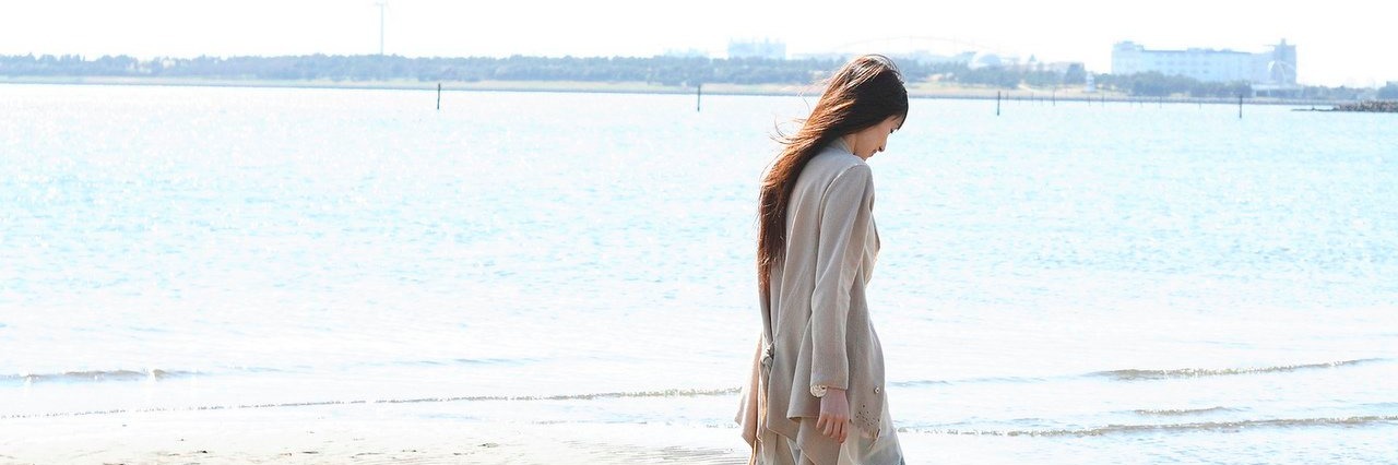 What's Inside My Coping ‘Toolbox’ on a Bad Day woman walking on the beach