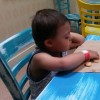 boy with down syndrome eating crackers