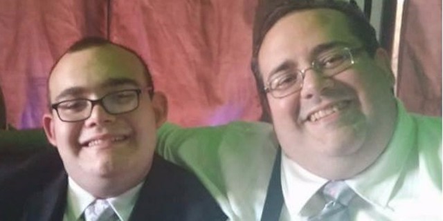dad and son with autism at the wedding