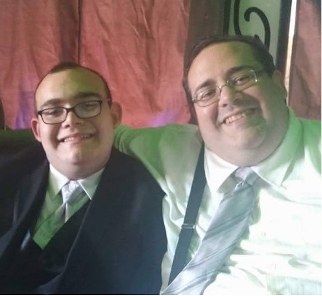 dad and son with autism at the wedding