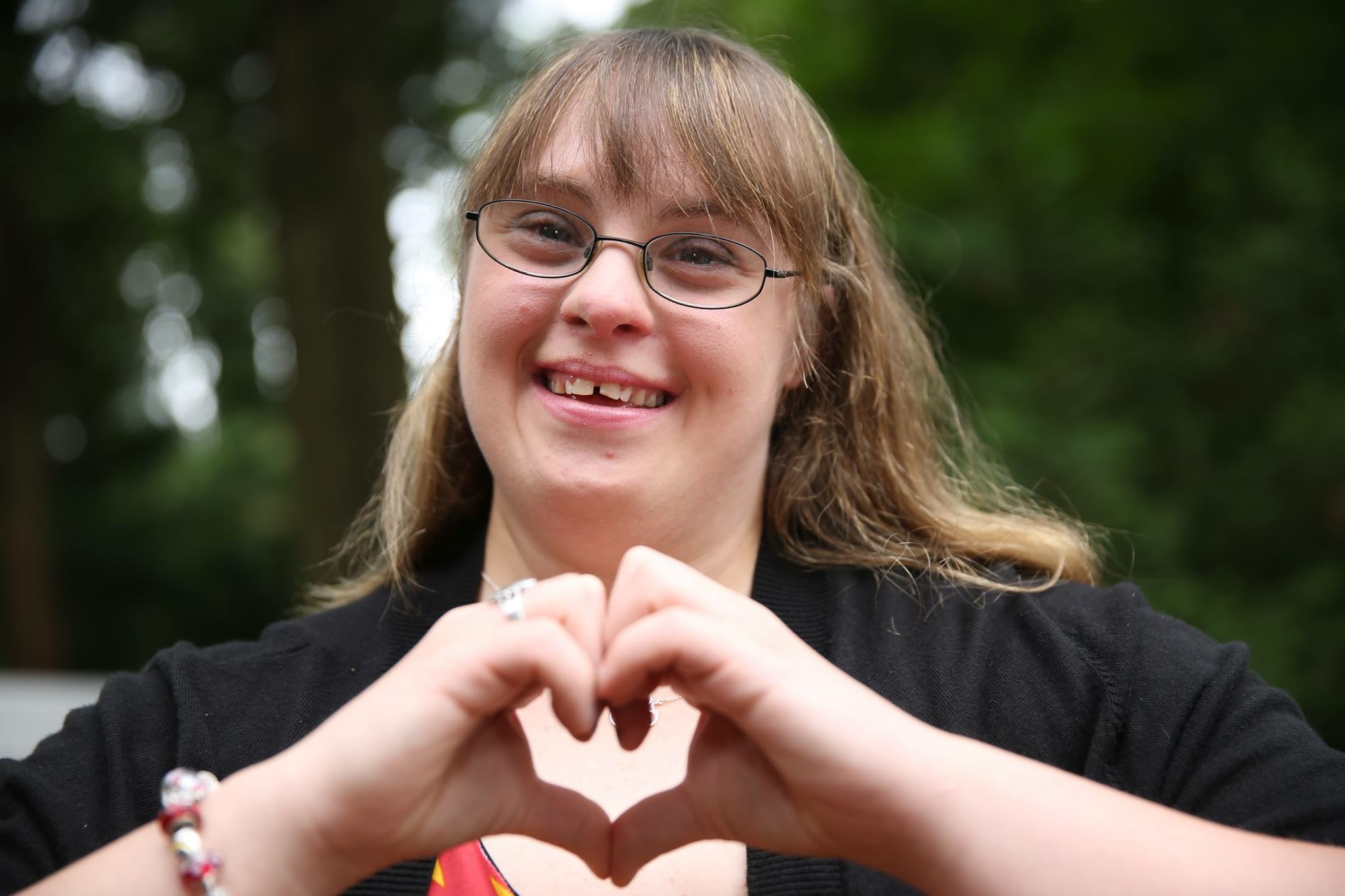 brittany making a heart with her hands