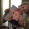 little boy with apraxia holding photo of gage golightly