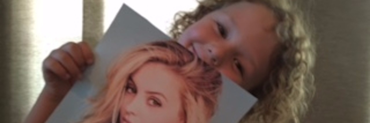 Mom of Boy With Apraxia of Speech Interviews Actress Gage Golightly little boy with apraxia holding photo of gage golightly