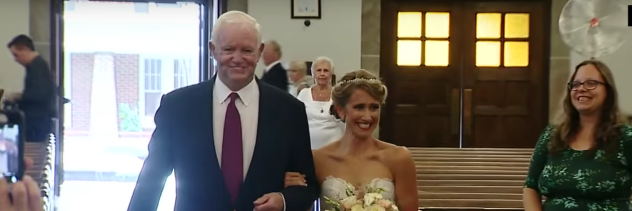 Mom of Girl With CHD Thanks Bride Whose Dad Donated His Heart bride walking down aisle with man who got her father's donated heart
