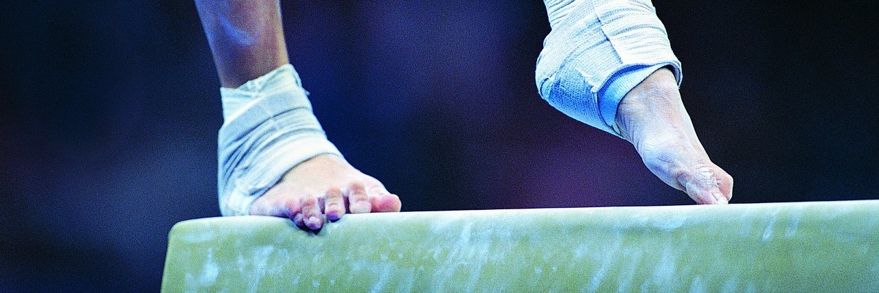Advice for Girls With Physical Limitations Who Want to Play Sports gymnast on a balance beam