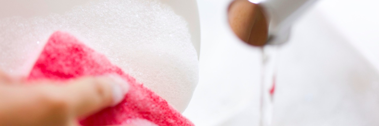 When You Wonder What 'Normal' Is In Life With OCD Woman washing dishes in sink