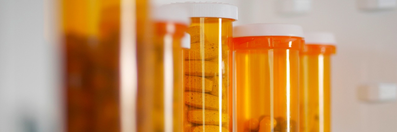 Don't Judge My Medicine Cabinet and Pills for Occipital Neuralgia Bottles of pills in cabinet, close-up