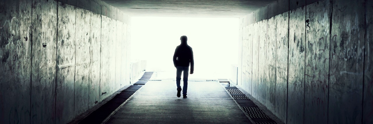 How Acceptance of Depression Can Lead to Recovery silhouette in a tunnel