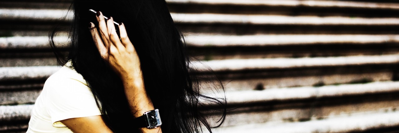 What Disguising My Anxiety Looks Like Woman covering her head with her hair