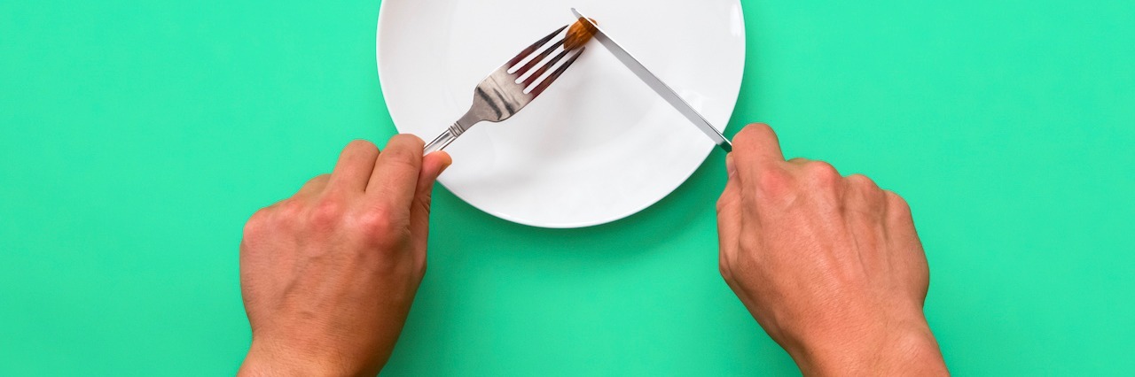 Lessons From the Southeast Eating Disorder Conference #SEED2016 Knife and fork cutting into small meal on a plate