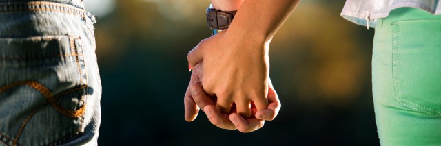 Couple holding hands.