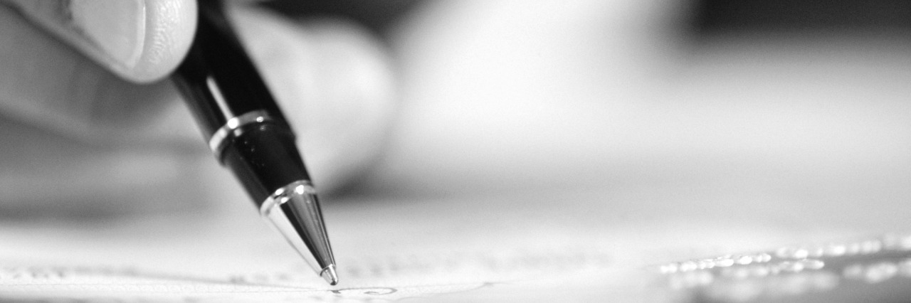 Edward Shoener Writes Obituary After Daughter, Katie, Dies by Suicide Person holding pen, close-up of hand and object