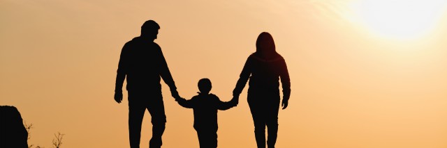 silhouette of family on the outdoor at dusk.