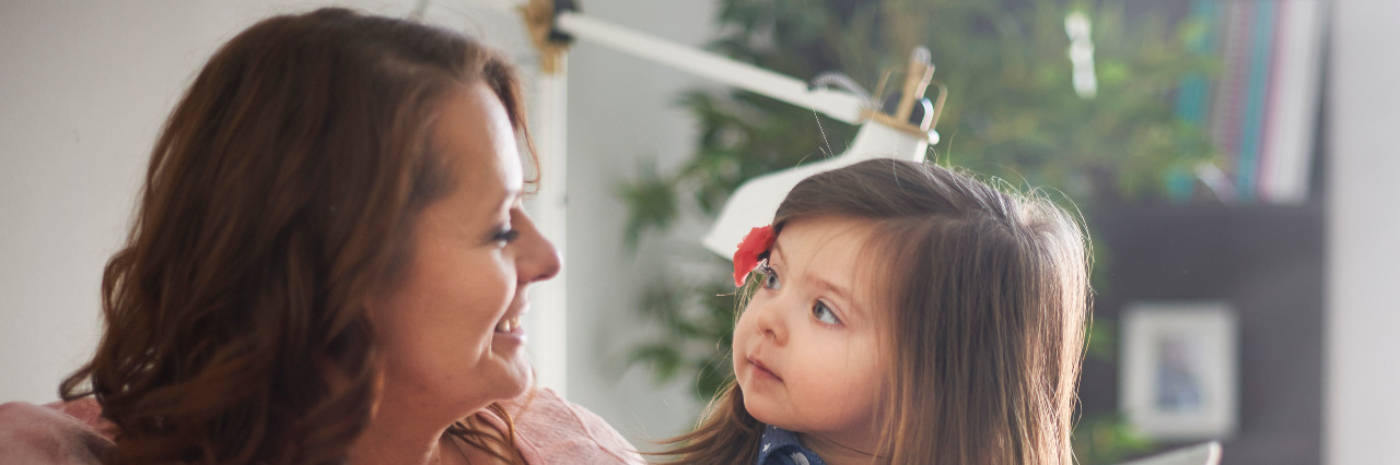 Mother talking to daughter.