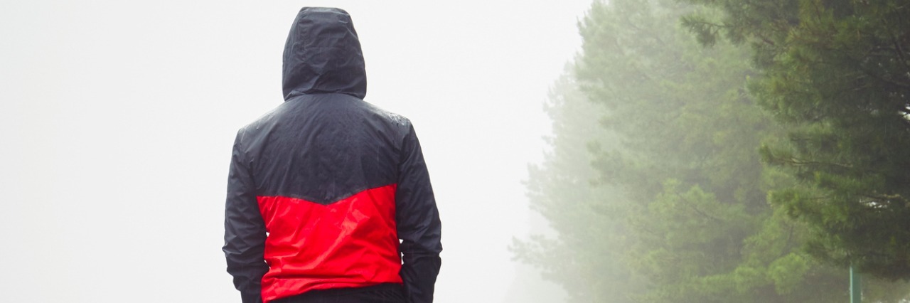 To the Person on the Autism Spectrum Going Through a Breakup Rear view of man walking down street next to trees on a foggy, overcast day
