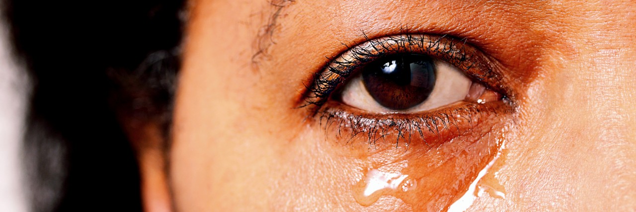 Managing Depression as an African American After Police Shootings Sad African American female with tears rolling down her face