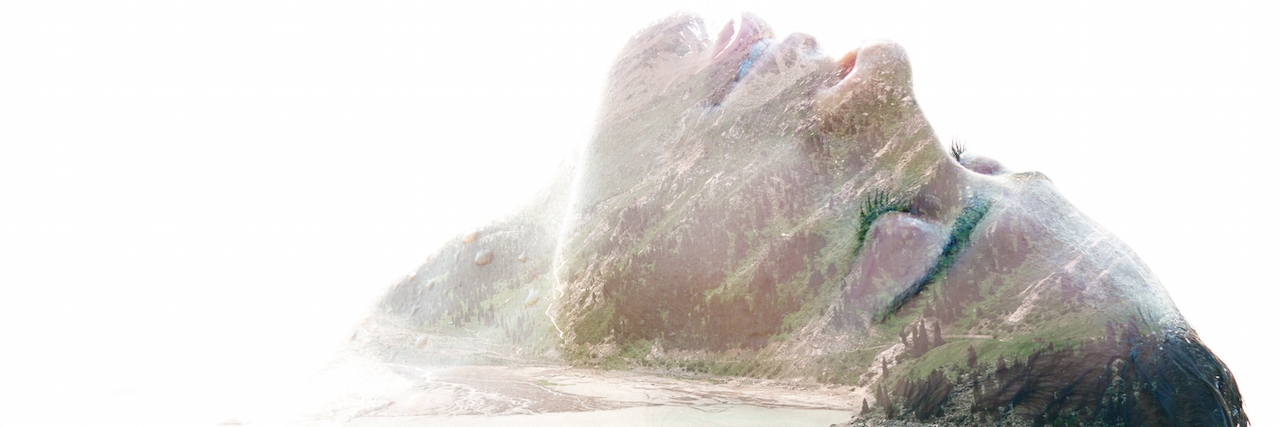 The Intensity of Emotion of Borderline Personality Disorder a woman lying on what looks like a lake in the mountains