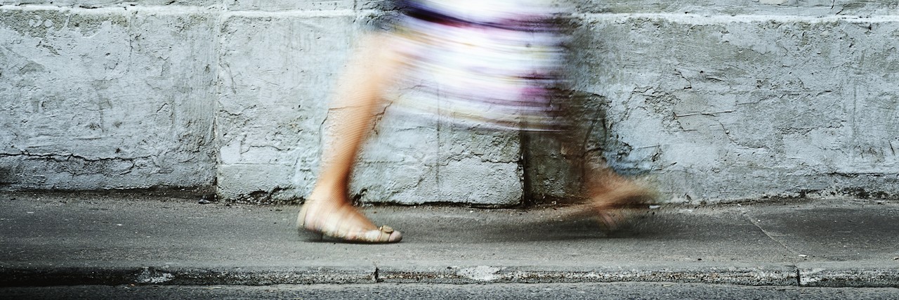 What Someone With Schizophrenia Wishes You Knew a woman walking on the sidewalk