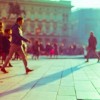 blurred picture of people walking through the city