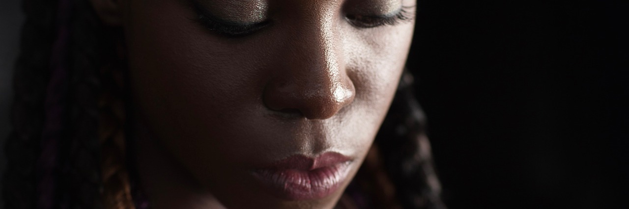 Story of a Black Woman With Anxiety and Depression close up of a woman with dreads