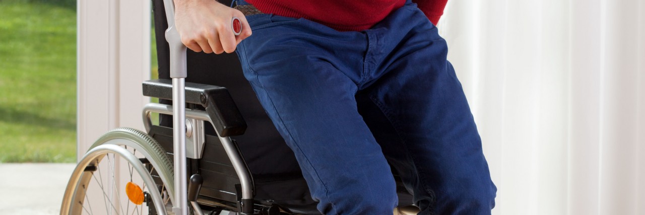 When Hunting for Disability Fakers Hurts Real Disabled People Disabled person standing up from wheelchair.