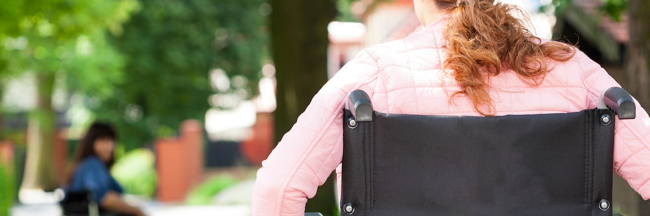 How People React When I Get Out of My Wheelchair woman wheeling wheelchair on path