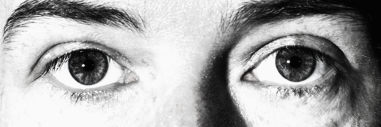 Depression Is Not Romantic: Here's What It's Really Like close up of sad eyes