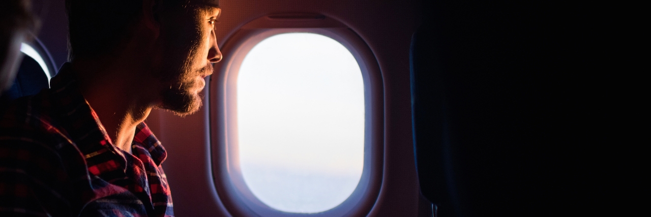 Man traveling by airplane.