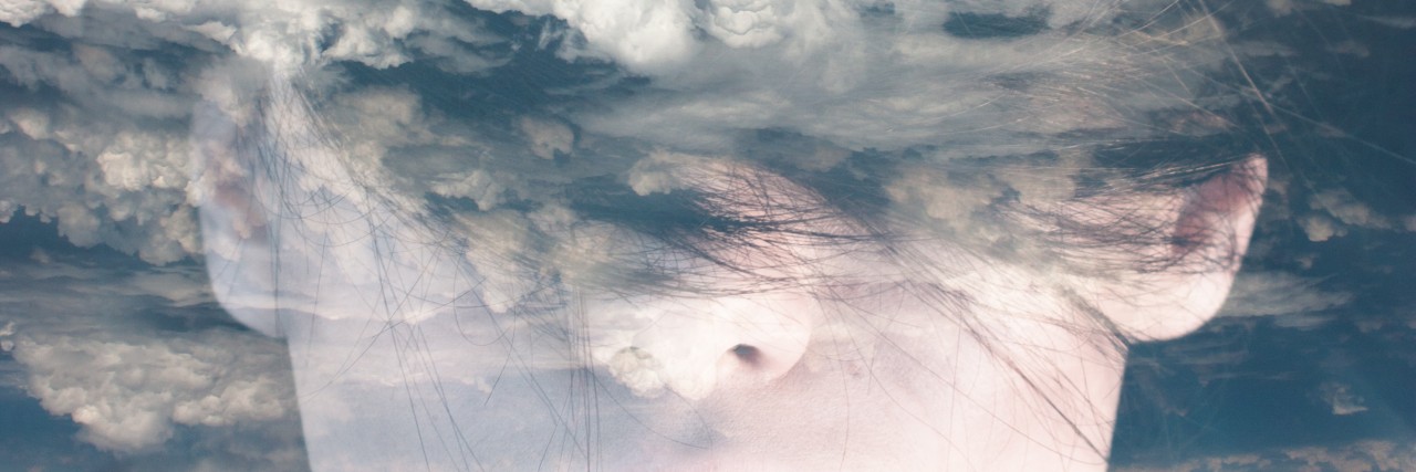 Dream like surreal double exposure portrait of attractive lady combined with aerial view photograph